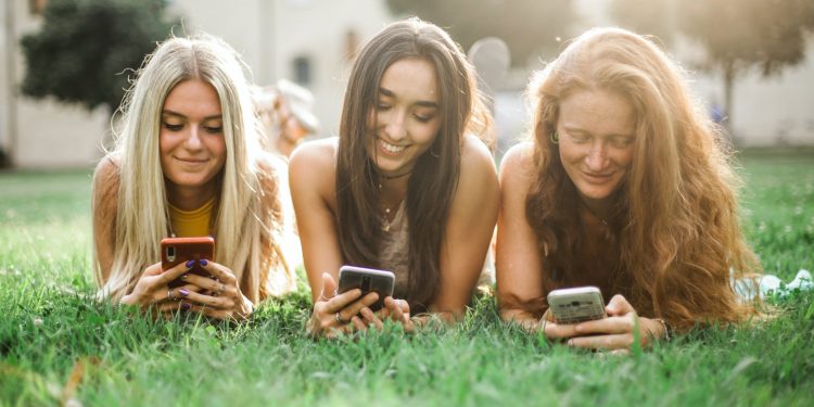 Picture with girls using mobile phones