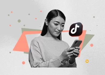 TikTok user applying Studio Ghibli AI filter to a family photo during April 2025 trend.