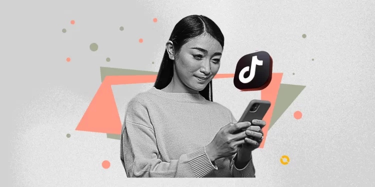 TikTok user applying Studio Ghibli AI filter to a family photo during April 2025 trend.