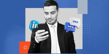 A professional recording a short video on LinkedIn while seated in a casual workspace