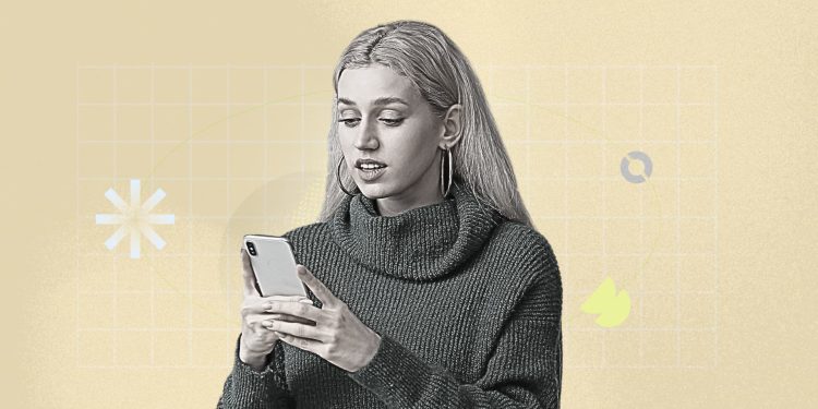 An autumn scene with golden leaves, a warm drink, and a journal laid open on a wooden table.