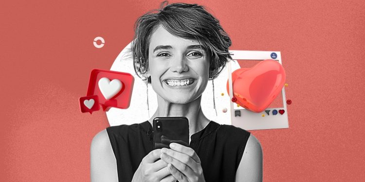 A cozy fall-themed Instagram Reel of a creator holding a latte in a warmly lit café, wearing an oversized sweater.