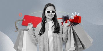 A dimly lit laptop screen showing Black Friday deals with a tired person scrolling