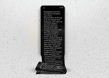 A content creator writing long-form content surrounded by AI-generated short clips.